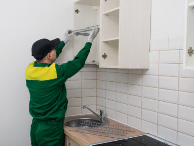 Kitchen furniture assembly and fitter assembles the upper cabinets